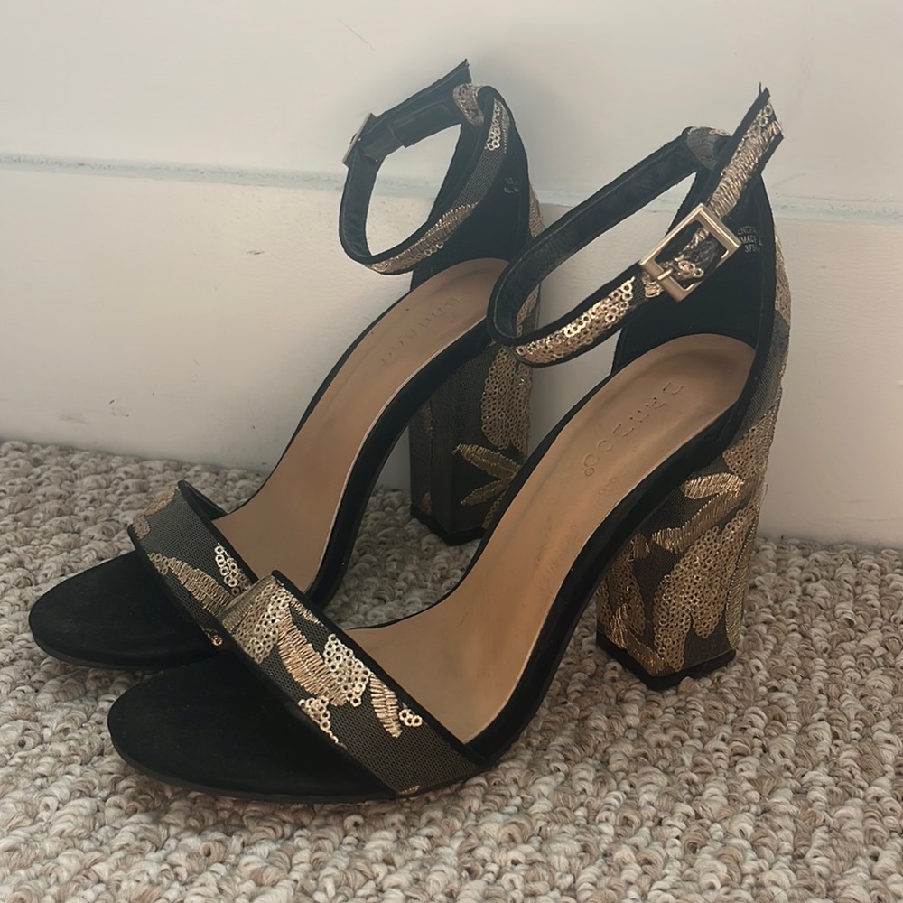 Black and gold heels
